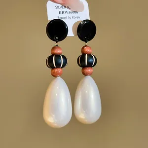 Vintage Chinese style earrings with wooden beads and pearlescent teardrops