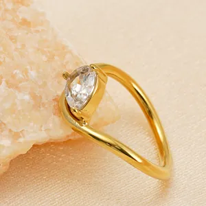 Macro detail of teardrop cubic zirconia ring with premium 18k gold plated finish.
