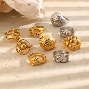Assorted minimalist stainless steel rings with 18K gold plating and hammered textures