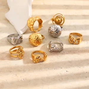 Detail view of geometric 18K gold plated stainless steel rings with hammered texture