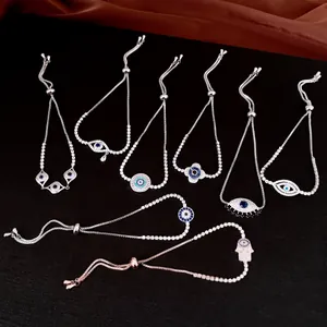 Détail de bracelets ajustables œil protecteur avec oxydes de zirconium bleus et blancs