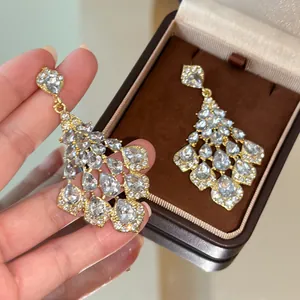 Detail view of elegant French vintage chandelier earrings with clear teardrop rhinestones