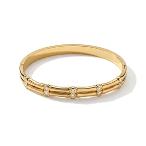 Elegant gold-plated geometric stainless steel bangle with sparkling cubic zirconia accents