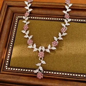Detailed view of luxury court style floral necklace with pink and clear rhinestones
