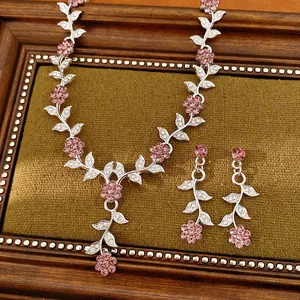 Elegant court style jewelry set with pink rhinestone flowers and silver leaf motifs.