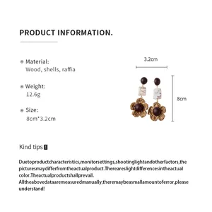 Detailed specification view of bohemian wood and raffia earrings with size info