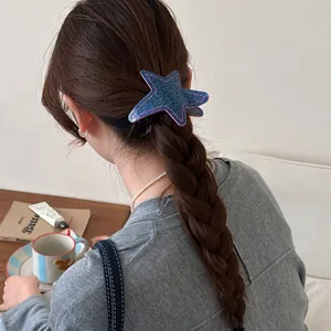 Denim texture star hair clip shown on a braided ponytail hairstyle in a cozy lifestyle setting.