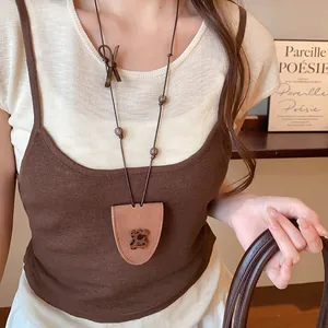 Detail of Korean style brown leather triangle glasses holder necklace with bear