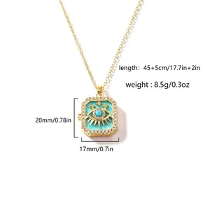 Detailed view of an openable gold-plated locket with evil eye and turquoise enamel