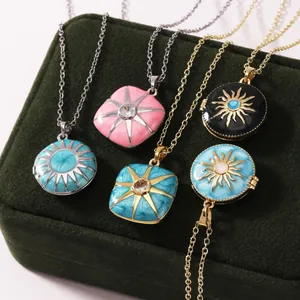 Detailed view of colorful stainless steel enamel sunburst locket necklaces on velvet box