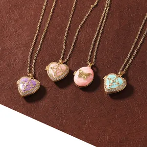 Detailed view of four stainless steel locket necklaces with colorful enamel and zirconia