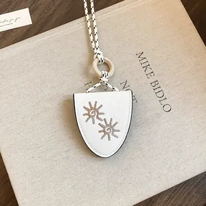 Detail of sun flower embroidery on white leather multifunctional necklace