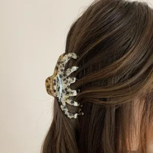 Large marbled acrylic leopard print shark hair claw clip for elegant bun hairstyles
