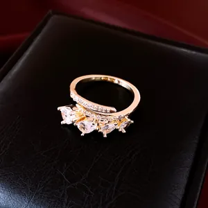 Detailed view of pear-cut zircon stones on a rose gold plated open ring