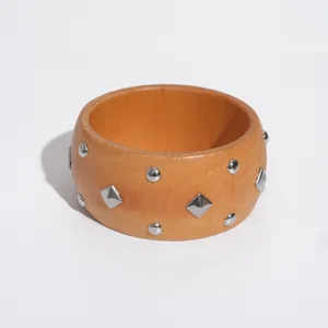 Retro ethnic style wooden bangle bracelet with silver geometric metal rivets and studs
