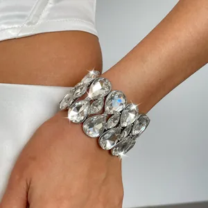 Close-up of sparkling water-drop crystals on a luxury elastic silver bracelet.