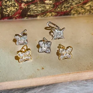 Detailed view of sparkling cubic zirconia star and clover ear cuffs for non-pierced ears.