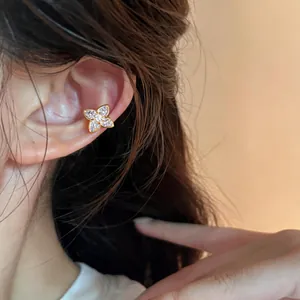 Sparkling zircon star ear cuff clip-on for non-pierced ears in elegant gold finish.