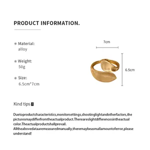 Detailed product specs of a twisted gold cuff bracelet with dimensions 6.5cm by 7cm