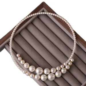 French vintage irregular double-strand pearl necklace with graduated pearl choker design.