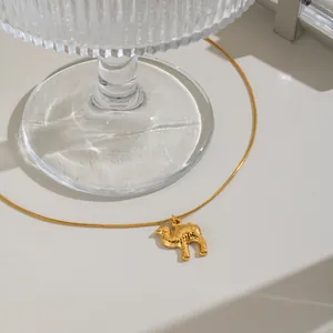 Close-up of a gold-plated stainless steel necklace featuring a detailed camel pendant