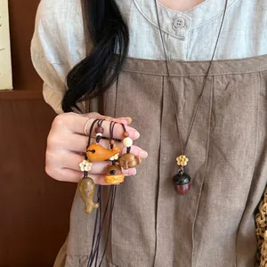 Collier Pendentif Animal en Bois Vintage pour Femmes Rétro Fait à la Main Bois Sculpté Éléphant Ours Baleine Chien Breloque Sautoir Bijoux