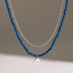 Detail view of double-layer necklace with blue natural stone beads and zircon water drop pendant