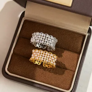Macro view of gold and silver plated rings with pearls and zircon in a jewelry box