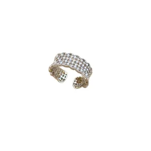 Elegant 18k gold plated lace open ring with tiny pearls and zircons on white backdrop