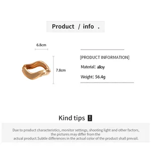 Detailed size and material specifications for the matte wavy geometric metal bangle