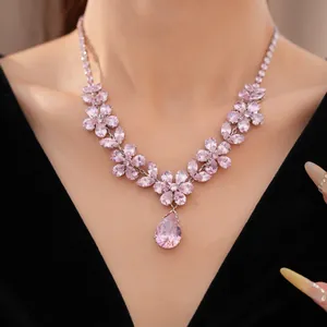 Detailed macro view of a pink zircon flower necklace with a large teardrop pendant