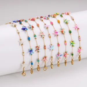 Bunte Seestern-Armbänder mit goldenen Edelstahlketten im modischen Ozean-Design