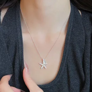 Minimalist silver crinkled starfish pendant necklace with LUCKY tag on delicate ball chain