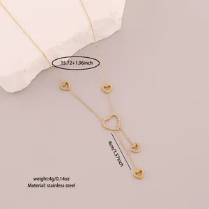 Macro view showing measurements of the gold stainless steel heart tassel necklace