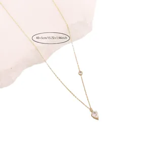 Minimalist gold Y-shaped stainless steel necklace with a sparkling heart pendant charm