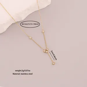 Detail view of minimalist gold stainless steel Y-necklace with white stones and dimensions