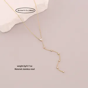 Minimalist stainless steel Y-shaped necklace with white crystals and length specs.