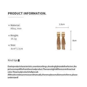 Product specifications for gold pleated tassel earrings showing 8cm length and material.