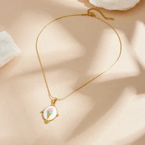 Detail of gold plated stainless steel necklace with enamel ice cream cone pendant