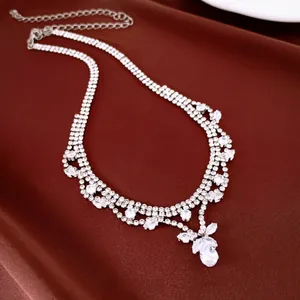 Detailed view of elegant bridal necklace with sparkling teardrop zirconia stones