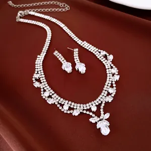 Detailed view of an elegant teardrop zircon necklace and earrings set for weddings.