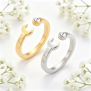 Detailed view of creative wrench-shaped stainless steel open ring with clear crystal