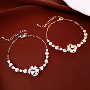 Bracelets croissant de lune et cœur plaqués or et argent avec zircons étincelants.