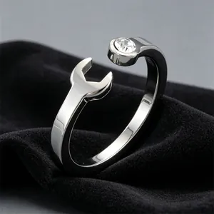 Close-up of stainless steel wrench ring with a clear inlaid sparkling stone detail