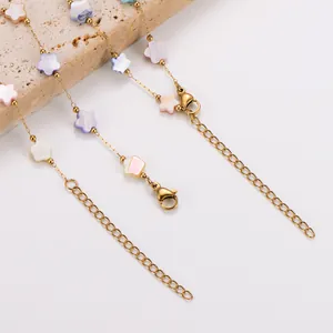 Close-up detail of stainless steel necklace with colorful shell flower charms