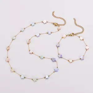 Detailed view of colorful shell flower necklace and bracelet set in gold-tone steel