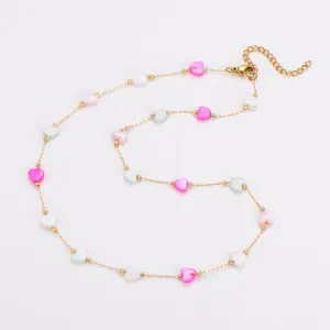 Detailed view of colorful shell heart beads on a delicate gold stainless steel chain.