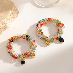 Colorful beaded dual-use hair tie bracelet with golden heart pendant detail