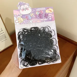 Detailed view of high elasticity bulk black rubber hair bands in cute rabbit theme packaging