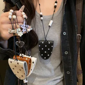 Stylish polka dot leather magnetic sunglasses clip necklace for portable eyewear storage
